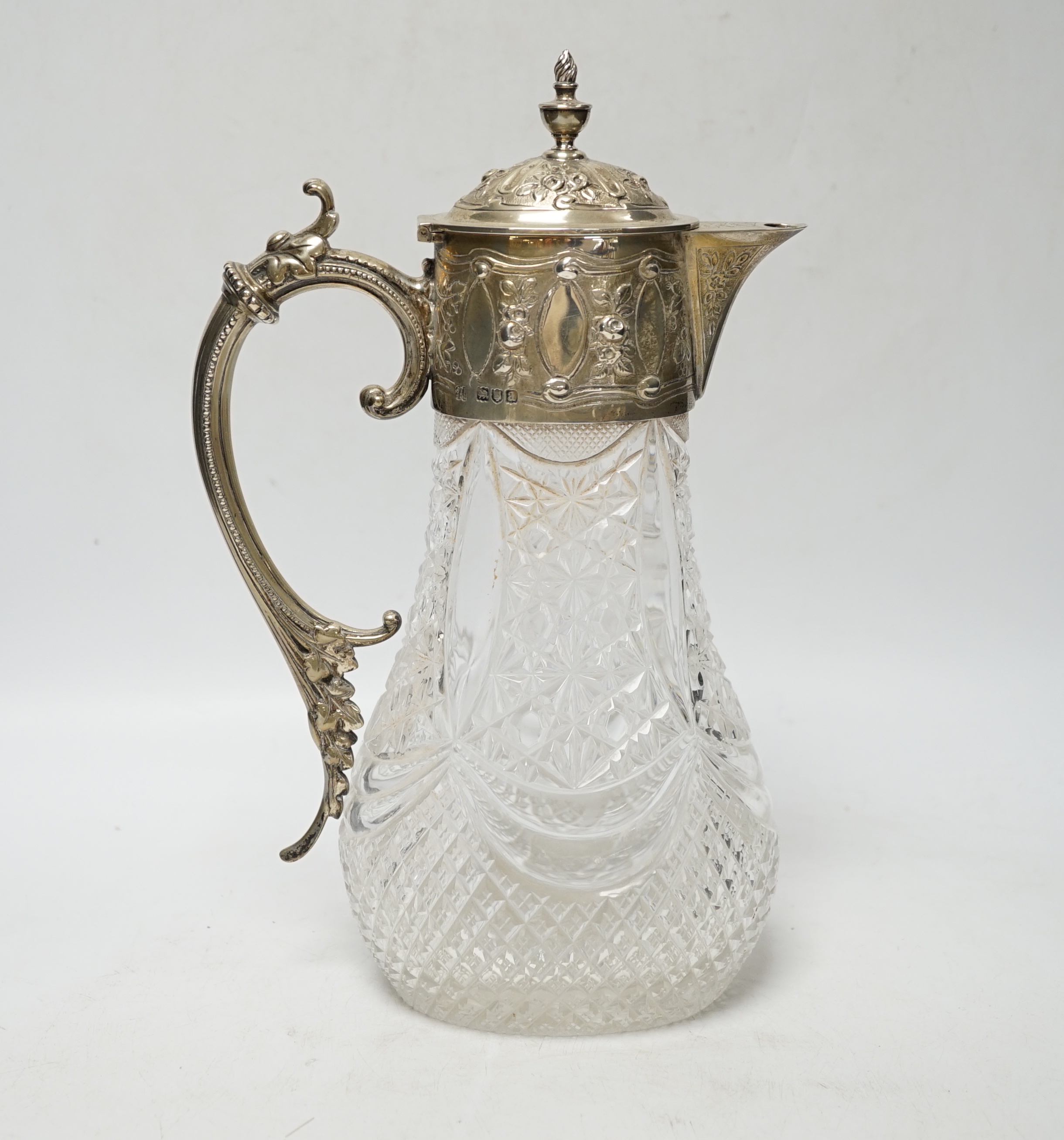 A late Victorian silver mounted cut glass claret jug, Hukin & Heath, London, 1896, 27.8cm.